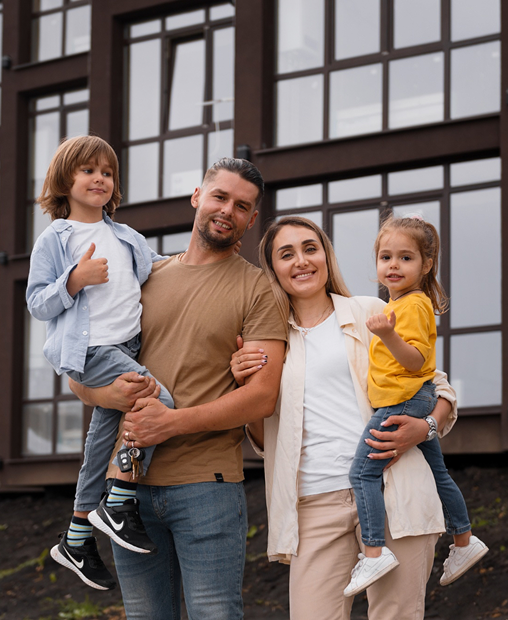 A happy family looking at their new home construction